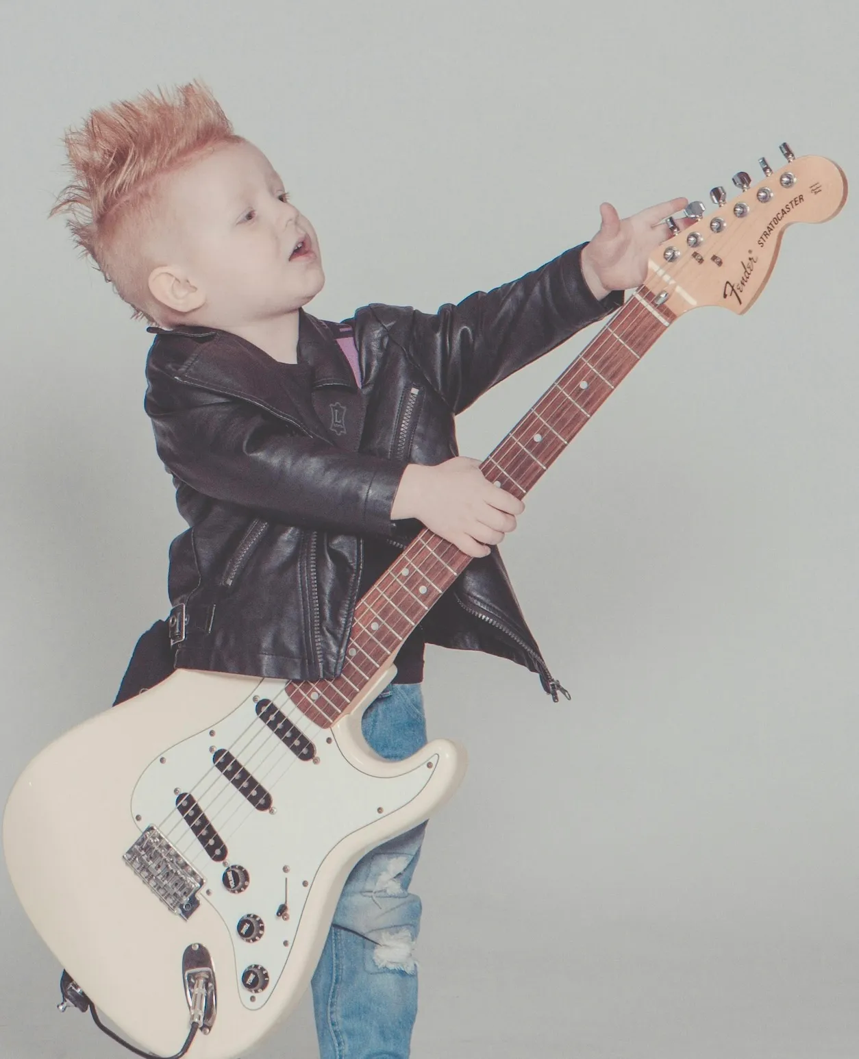 Child playing guitar